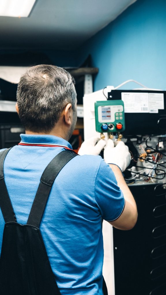 Technician working on an air conditioner repair